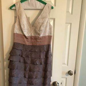 Elegant shimmering v neck cascading dress.